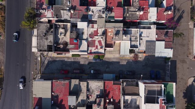 Aerial drone landing shot showing rooftops in a residential zone of Ecatepec, Mexico