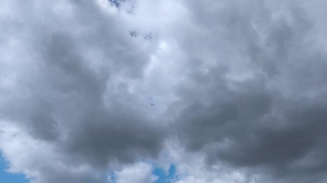 Impressive landscape of two types of clouds and one black and the other brighter