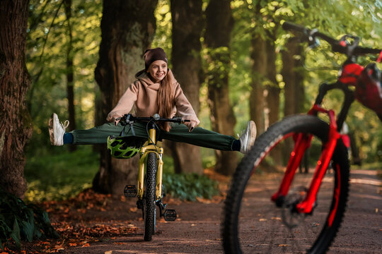 Happy kid enjoying bike ride in nature on a sunny day.