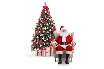Christmas tree and santa claus resting in an armchair
