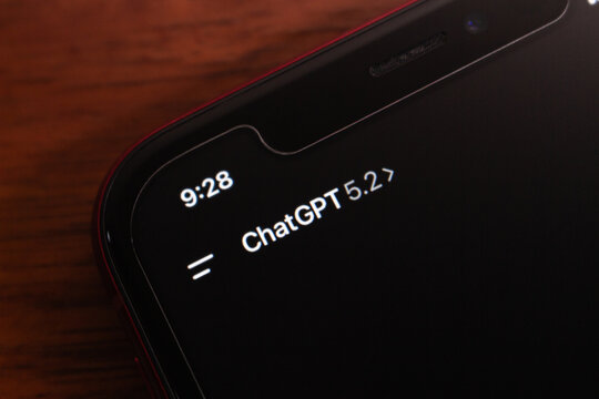 Quito, ECUADOR - Dec 15 2025 : A macro photo showing the ChatGPT 5.2 interface on a smartphone screen, captured in dark mode with clear text and a visible notch.