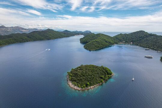 Aerial view of emerald islands nestled in the sapphire embrace of the Adriatic Sea, a tapestry of nature's finest hues, Sipanska Luka, Dubrovnik-Neretva County, Croatia.