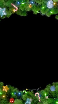 Vertical Christmas frame or new year frame with green fir or pine leaves, christmas balls, stars and light bulbs blinking with alpha map for compositing. 4K loop animation.