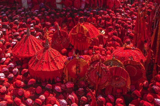 Veer, India - 05 March 2024: Aerial view of a sea of vibrant red engulfing the crowd gathered at Veer Mhaskoba Temple, Maharashtra, creating a mesmerizing spectacle.