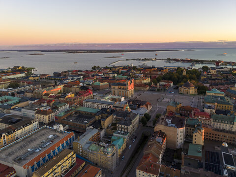 Aerial view of the grand Stortorget square and historic buildings bask in the warm glow of sunset, Karlskrona, Blekinge County, Sweden.