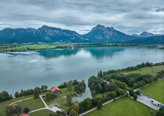 aerial photo of the alpine landscape at lake Forggensee in the eastern Allgaeu near city of Fuessen, Bavaria, Germany 