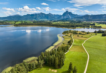 aerial photo of the alpine landscape at lake Hopfensee in the eastern Allgaeu near city of Fuessen, Bavaria, Germany 