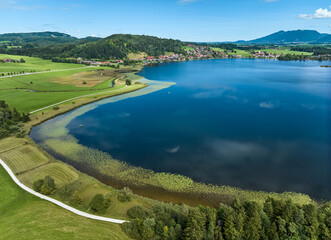 aerial photo of the alpine landscape at lake Hopfensee in the eastern Allgaeu near city of Fuessen, Bavaria, Germany 
