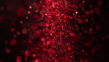 Glowing vertical column showing lit red particles in dark studio, with round bokeh highlights