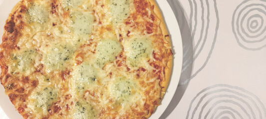 Delicious three cheese pizza. Zenith view and copy space.