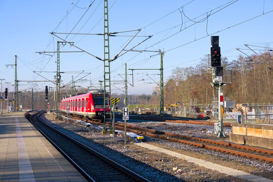 Red Rhein Main S-Bahn train at railway station Frankfurt am Main Stadion on an autumn day. Photo taken November 22nd, 2025, Frankfurt am Main, Germany.