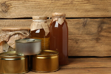 Humanitarian aid. Various food products for donation on wooden table
