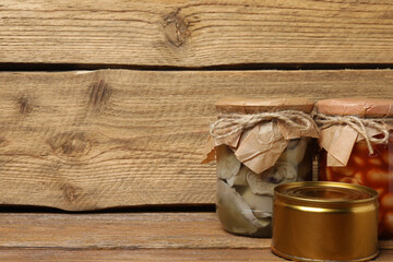 Humanitarian aid. Various food products for donation on wooden table
