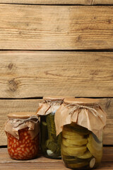 Humanitarian aid. Various food products for donation on wooden table
