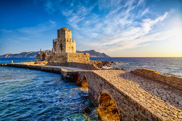 The Venetian Fortress of Methoni with Bourtzi Tower in Peloponnese, Messenia, Greece, during sunset time