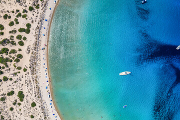 Aerial overhead view of the turquoise sea at the popular Voidokilia beach in Messinia, Peloponnese, Greece