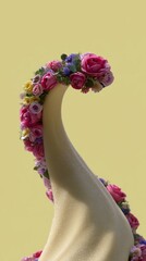 Obraz premium Elegant fabric swirl adorned with vibrant blooms, reminiscent of floral art fashion, evocative of May Day celebrations