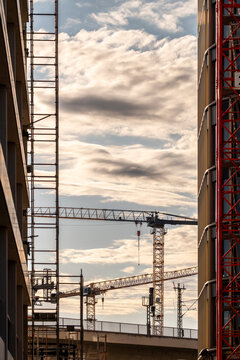 Large construction crane supporting infrastructure urban architecture building development industry city growth and long term metropolitan progress
