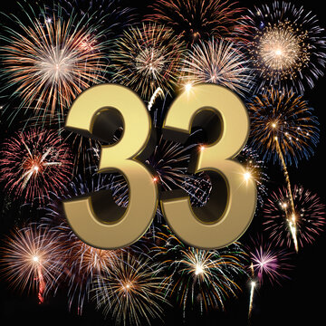 Gold number 33 with fireworks in the background. Festive scene for birthday or anniversary party