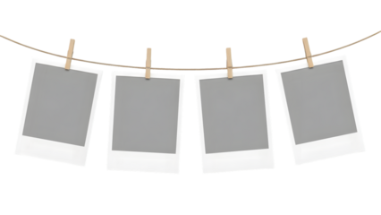Four blank polaroid on a clothesline isolated on a transparent background rope clothespins