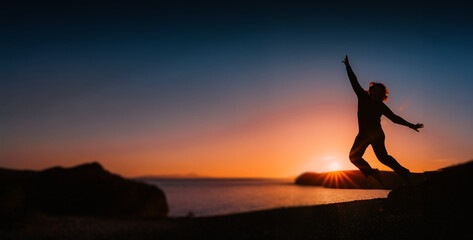 Solitary traveler at sunset reflecting on life journey, freedom and personal transformation during...
