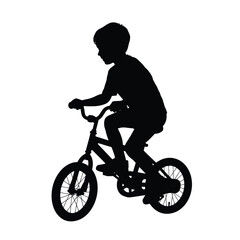 Obraz premium Silhouette of a child riding a bicycle