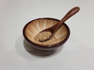 Sesame Seeds or Perilla Seeds in Traditional Korean Ceramic Bowl and Mortar