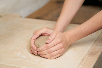 Pottery class. Hands hols clay