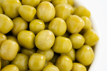 Fresh green peas background, texture of perfect peeled sweet pea grains as background. Vegetable background, vegetable protein, healthy products. Canned peas. spinning in a circle