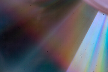 Abstract vintage-style background featuring textured grain, dust, scratches, and soft colorful light effects. Aged analog aesthetics create a dynamic, distressed atmosphere suitable for cinematic and 