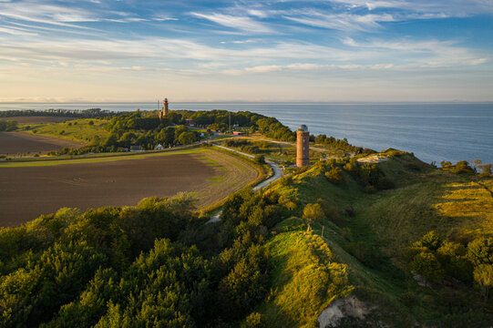 Aerial view of the iconic Kap Arkona lighthouse standing tall against the Baltic Sea's horizon, a beacon of history and navigation, Putgarten, Mecklenburg-Vorpommern, Germany.