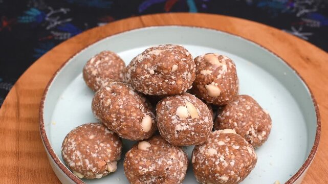 low cost affordable peanuts and jaggery mithai or sweet served in a plate. economical cooking, traditional recipes, and cost-effective nutrition for everyday families