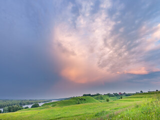 Beautiful, serene landscape with a large cloud in the sky