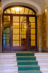 Entryway of an old residential building near Corso Sempione, Milan, Italy