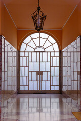 Entryway of an old residential building near Corso Sempione, Milan, Italy