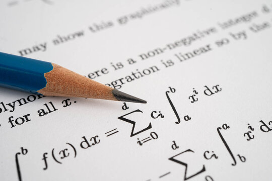 Pencil on mathematic formula exercise test paper in education school.