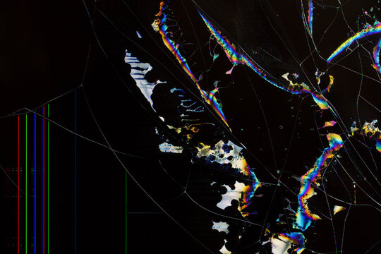 Abstract digital breakdown: flowing crystal-like stripes and cracks in vivid colors across a shattered LCD screen surface.