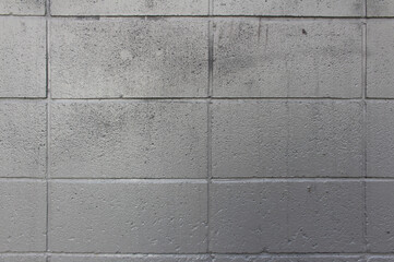 Gray square concrete wall background. Cement wall texture.