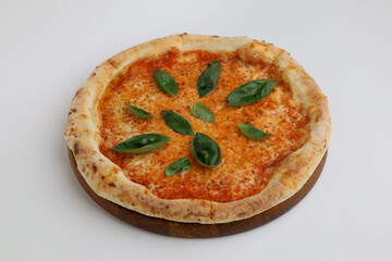 Neapolitan pizza margherita with tomatoes and cheese mozzarella on wooden board on white background