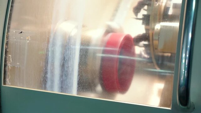 Production of seals on the CNC machine. the worker measures the dimensions of the rubber gasket with a vernier caliper