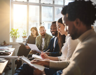 Group of people engaged in discussion during a warm candid moment in a bright room
