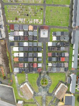 Aerial view of cemetery of Serino and headstones bask in the soft light, framed by green spaces and pathways, Serino, Irpinia, Italy.