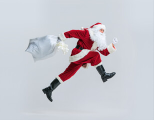 Santa Claus runs with a bag during the holiday season in a cloud wonder setting filled with joy and celebration