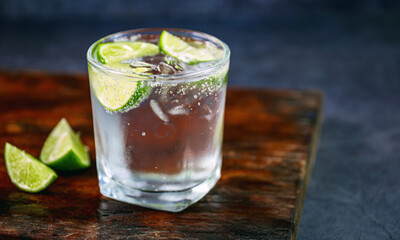 Citrus lemonade lemon cocktail on gray background, Vodka lime
