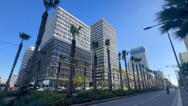 tram on the railway passing through an intersection in Casa Finance City. Casablanca, Morocco