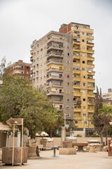 High rise apartment building across the street from the Catacombs of Kos el Shoqafa in Alexandria, Egypt