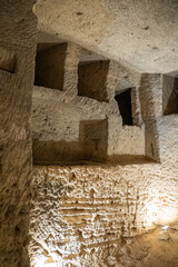 Burial niches along a wall of the Catacombs of Kom el Shoqafa in Alexandria, Egypt