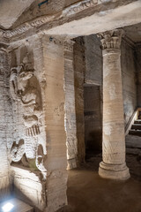 Bas relief carving of a jackal in a toga on the wall of a burial chamber in the Catacombs of Kom el Shoqafa in Alexandria, Egypt