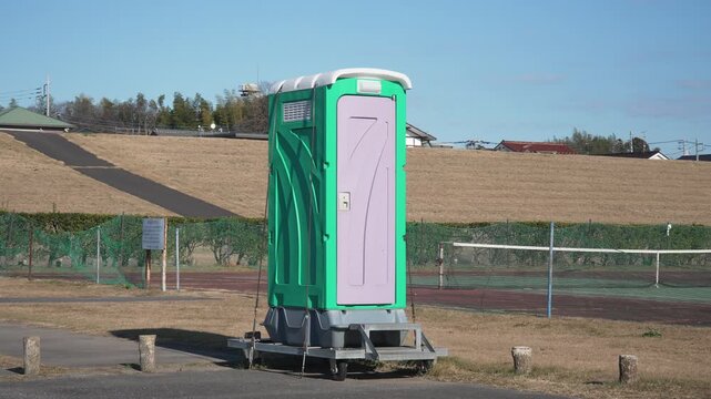 ow of portable toilets on a construction site or outdoor event venue