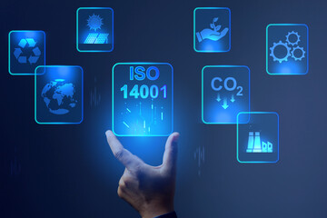 ISO 14001 concept with hand rising virtual screen for environment management system represent to...